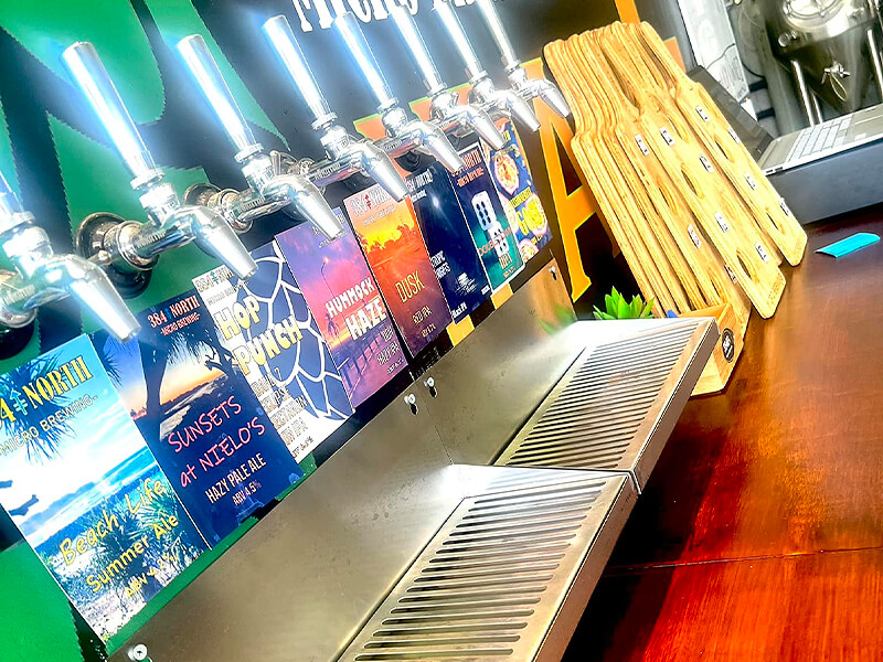 Close up view of the 8 taps at 384 North Brewing brewhouse